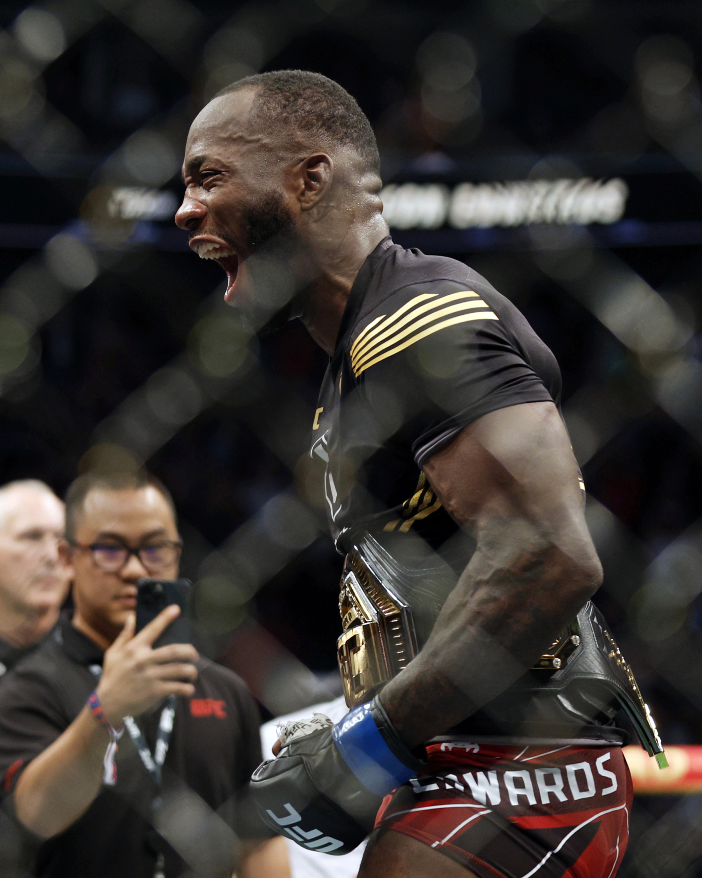 Aug 20, 2022; Salt Lake City, Utah, USA; Leon Edwards (blue gloves) reacts after defeating Kamaru Usman (red gloves) during UFC 278 at Vivint Arena. Mandatory Credit: Jeffrey Swinger-USA TODAY Sports